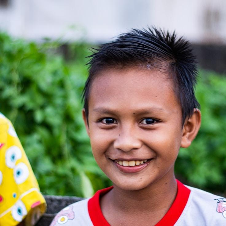 Mira Solis, Lead Design Curator at Gentle River Horizon, reviewing corporate floral arrangements